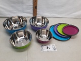 set of four metal bowls with plastic lids