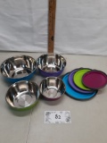 set of four metal bowls with plastic lids