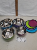 set of four metal bowls with plastic lids