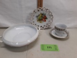 Gold painted teacup and saucer, wall plate with fruit, and double handle bowl