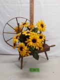 spinning wheel décor with silk floral display