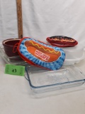 USA Bean Pot (no Lid), 2 pyrex glass dishes, 1 blue glass dish, potholders, Rubbermaid Serving Dish