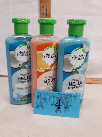 three bottles Herbal Essences conditioner
