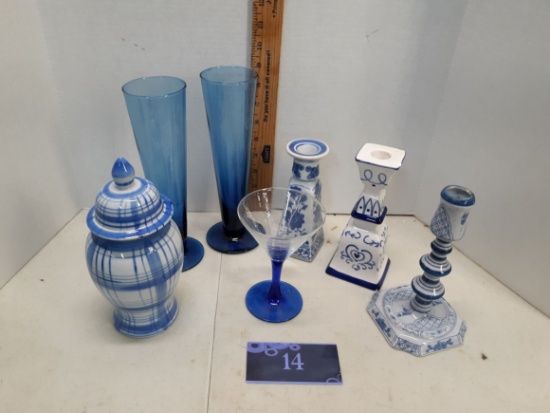 Blue and white ceramic candle sticks, lidded urn, two blue glass tall vases, martini glass