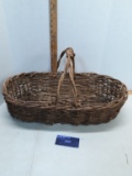 Large oval handled basket, stick woven