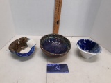 Three handmade bowls, clay, blue/white/teal, signature looks like Yuna