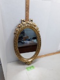 Home interior gold mirror