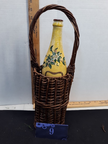 handpainted wine bottle in wicker holder