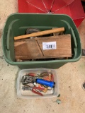 bin of various tools, hand mixer, leather punch, etc