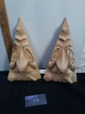 2 hard carved tree man faces