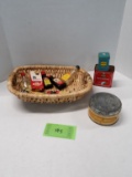 Basket of tins and bottles, tea, spices, and extracts