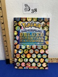 Pokémon Deluxe Essential Handbook Gotta Catch 'Em All Scholastic Paperback Book