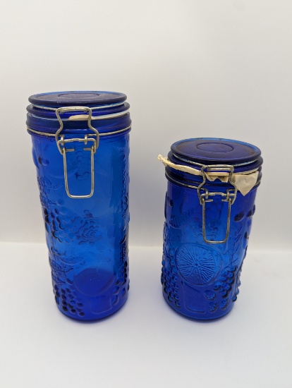 (2) blue canisters
