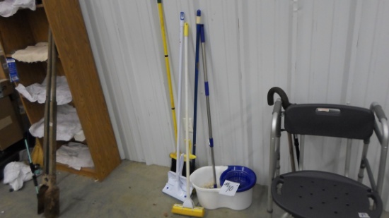 cleaning supplies, mops, duster, broom and a hands free mop bucket