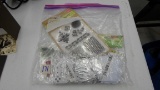 arts and crafting items, gallon bag full of new metal stenciles, iron ons, stickers, and much more