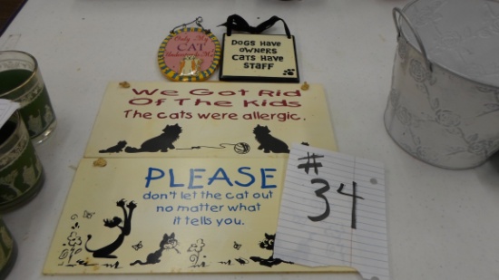 cat decor, various signs with funny sayings on them