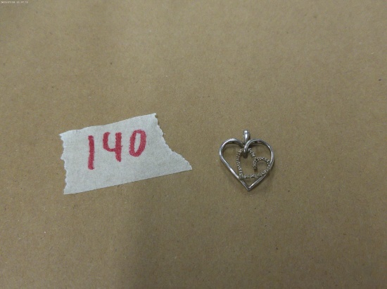 silver heart charm, marked 925 with small stones 1.4g