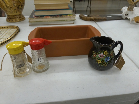 dishes, vintage salt and pepper set, dark floral creamer, and a clay baking dish