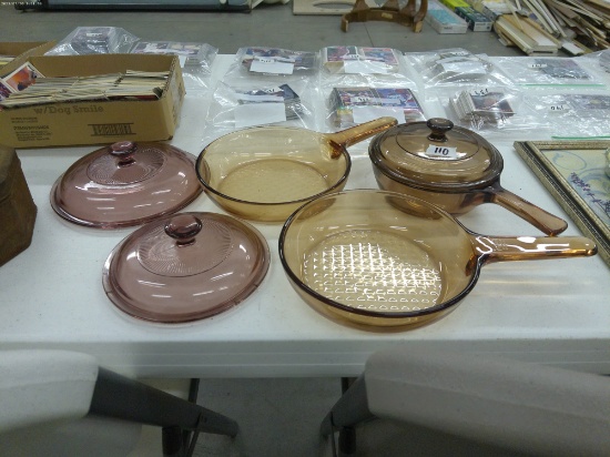 corningware, includes a small covered pot, two 7in pans and 2 pink glass lids