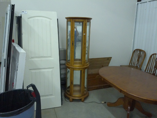 lighted display cabinet, wood with rounded glass 72in tall and 23in wide