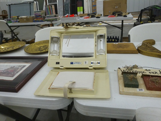 vintage travel makeup mirror and stroage cabinet, made by rayette has a stand and storage box does w