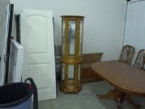 lighted display cabinet, wood with rounded glass 72in tall and 23in wide