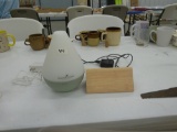 home electronics, digital modern wood alarm clock and a young living essential oils machine both in