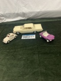 Three toy/model cars