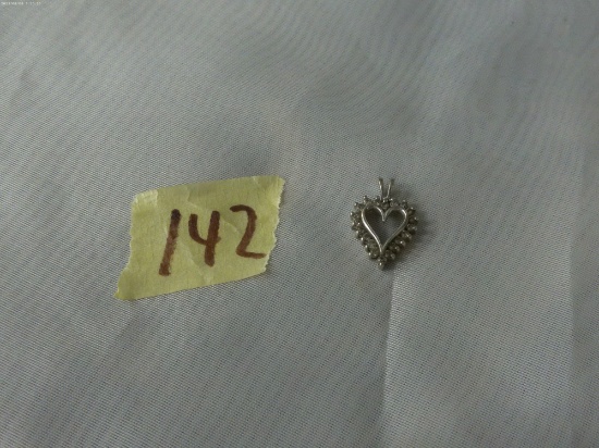 10k gold heart charm, 10k gold with assortment of clear stones 2.2g