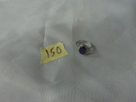 fashion ring, size 7 silver plated ring with large purple stone and small clear stones