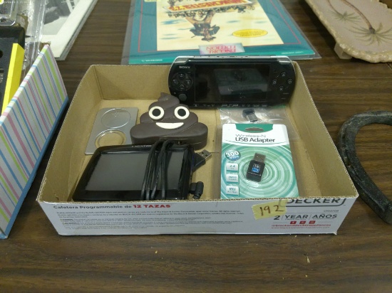 electronic lot, nextar gps, psp, usb adapters, poop emoji power block and mag glass