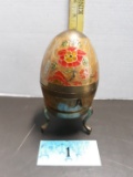 Vintage brass and enameled egg-shaped trinket box on a stand