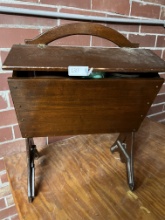 Side Box filled with sewing supplies, hinged up doors