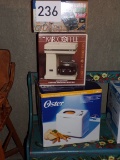 Coffee pot, phone and bread maker in box