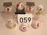 7 baseballs in cases