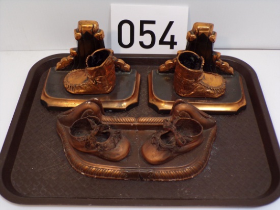 Bronze Bookends And Chalkware Baby Shoe Co. Advertisement