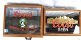 Two Coors Lighted Mirror Signs