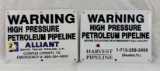 Two Alliant and Harvest Pipeline Metal Signs