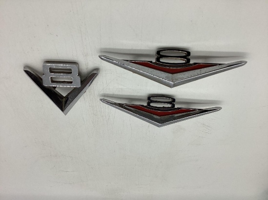 Three V-8 Car Emblems