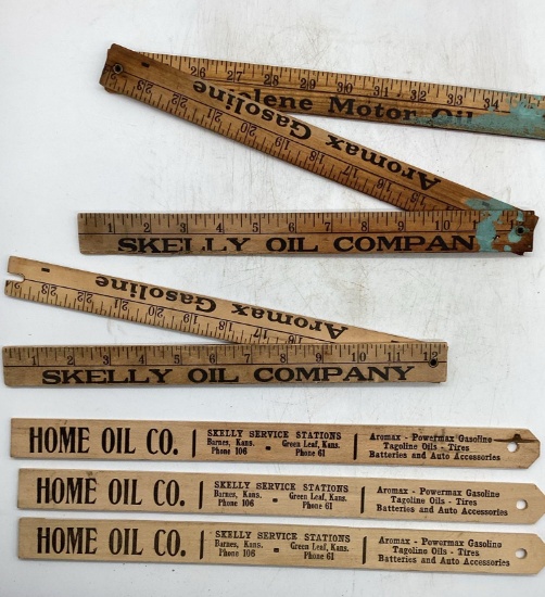 Skelly Folding Yardstick and Three Skelly Home Oil Company Model T Measuring Sticks