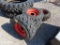 4 SKID STEER TIRES AND RIMS