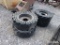 4 SKID STEER TIRES AND WHEELS