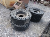 4 SKID STEER TIRES AND WHEELS