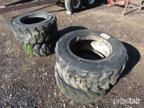 4 SKID STEER TIRES AND WHEELS