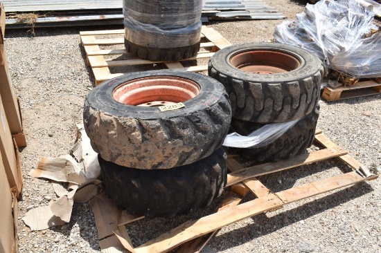4 - SKID STEER TIRES AND RIMS
