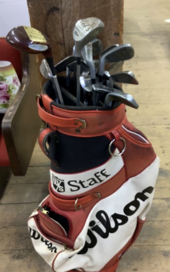 Golf clubs in Wilson Staff bag