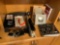 Bose headphones, digital camera, frames, books, paper cutter and everything on the shelf