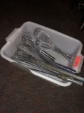 multiple large stainless steel whisks