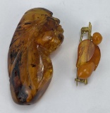 Carved Amber Brooch and Figure