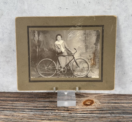 Woman with Bicycle Cabinet Photo
